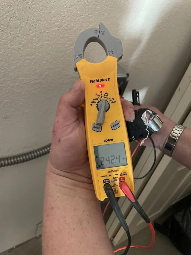 Voltage testing with clamp meter during Generator Installation in Isla Vista